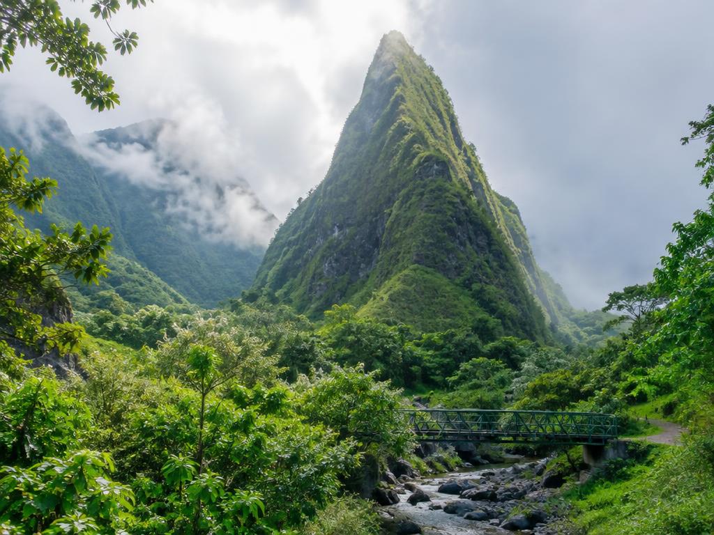 ʻĪao Needle rising above rainforest in ʻĪao Valley